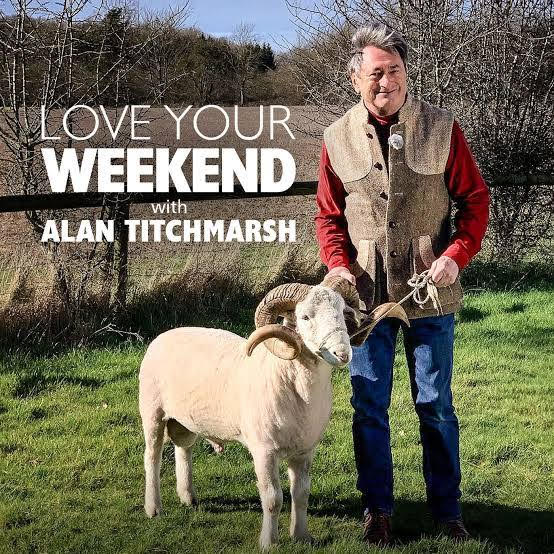 Alan Titchmarsh handling a sheep